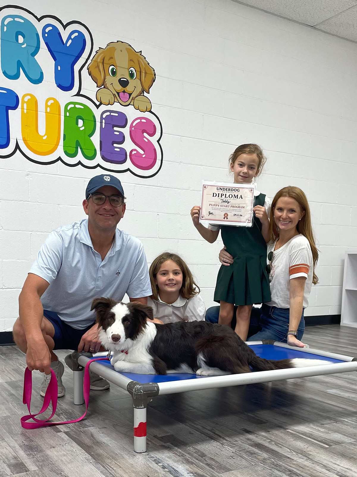 Family with trained puppy